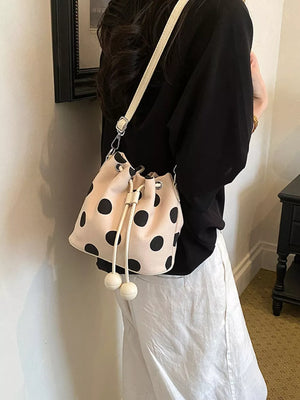 crossbody bag in White with polka dot and drawstring closure