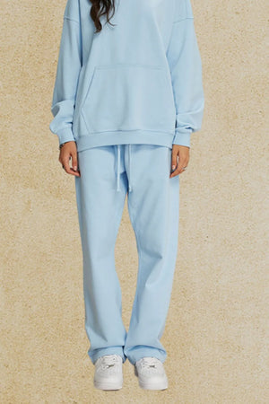 Light blue relaxed fit lounge trousers with drawstring waist.