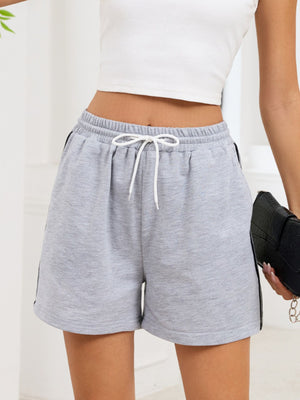 Heathered gray jogger shorts with drawstring and sporty side trim.