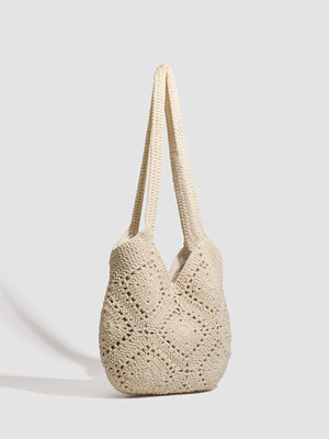 cream handbag featuring crochet knit and geometric