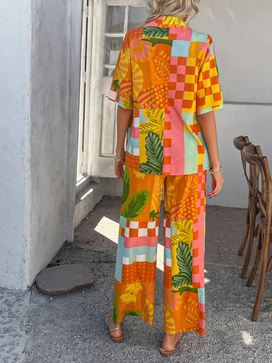 Women's multicolor abstract print resort co-ord set with wide-leg pants and short-sleeve button-up shirt.