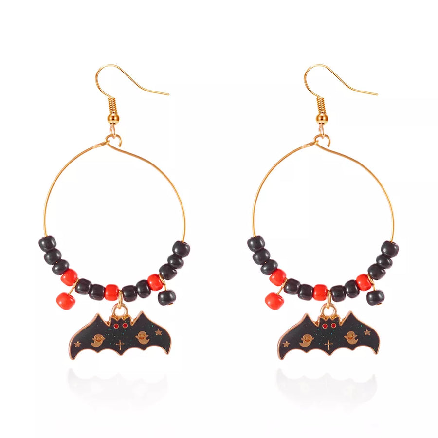 earrings in red with geometric and bat charm
