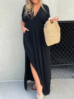 Black V-neck maxi dress with smocked waist, dolman sleeves, and high slit
