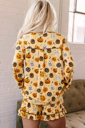 orange pajama set featuring buttoned and pumpkin-print