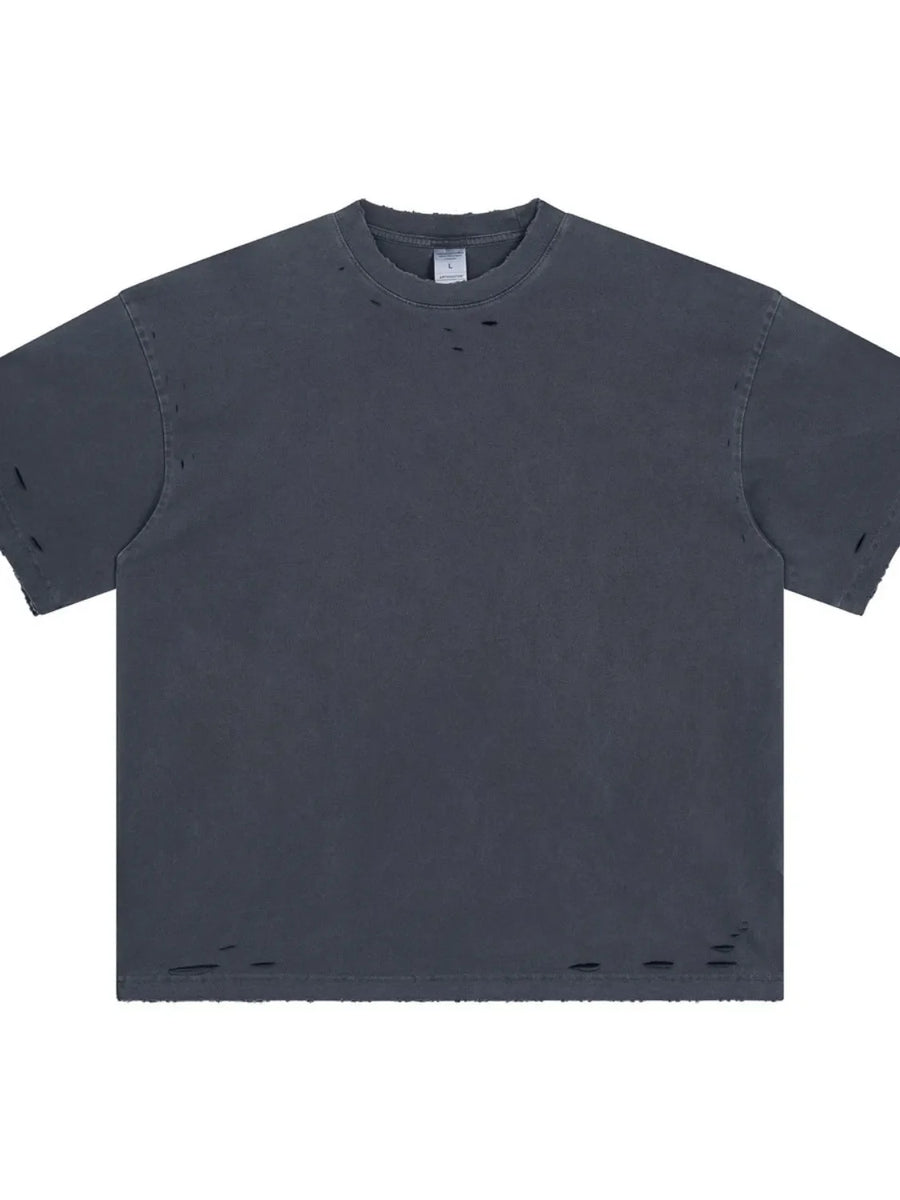 Distressed oversized cotton tee in dark gray with ripped details on the neckline and hem.