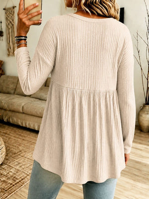 cream blouse with hip-length and half-button
