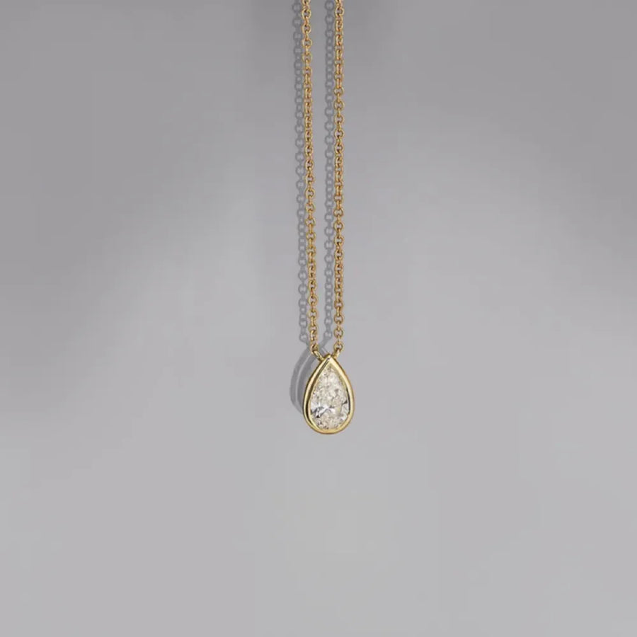 18K gold-plated necklace with bezel-set pear-shaped diamond pendant
