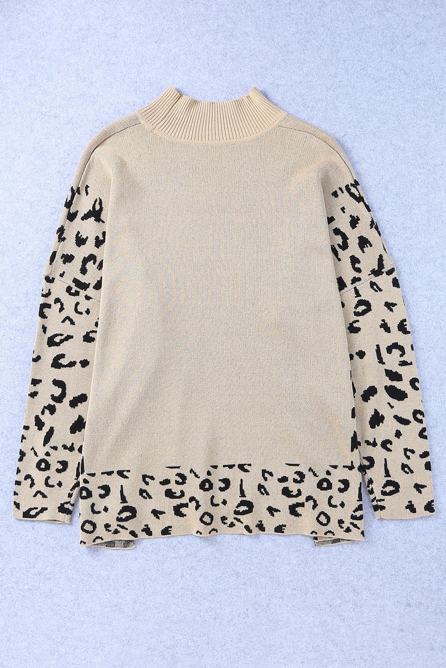 Khaki acrylic knit sweater with mock neck and leopard print sleeves and hem.