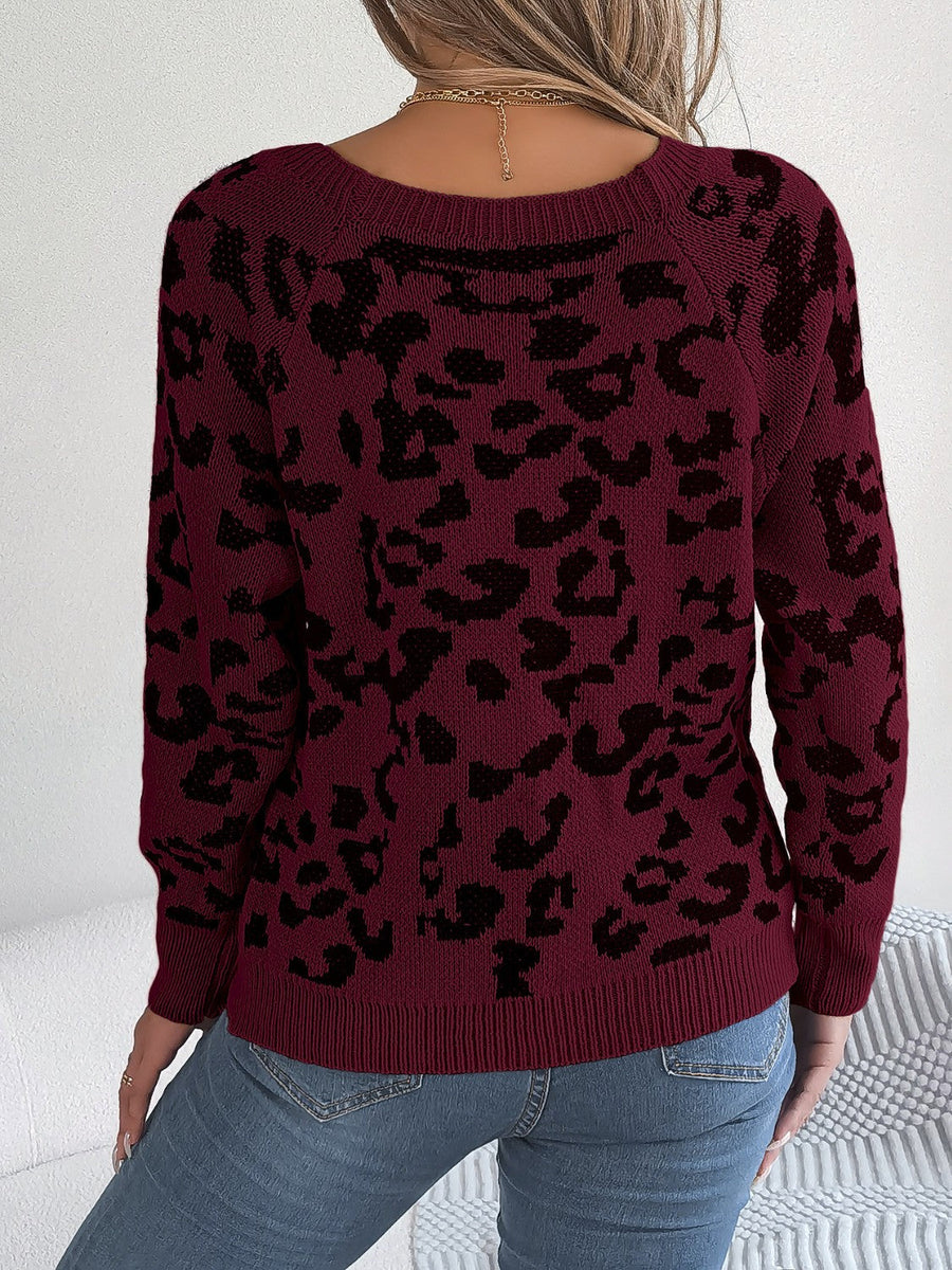 Wine leopard print acrylic sweater with button detail and crew neck.