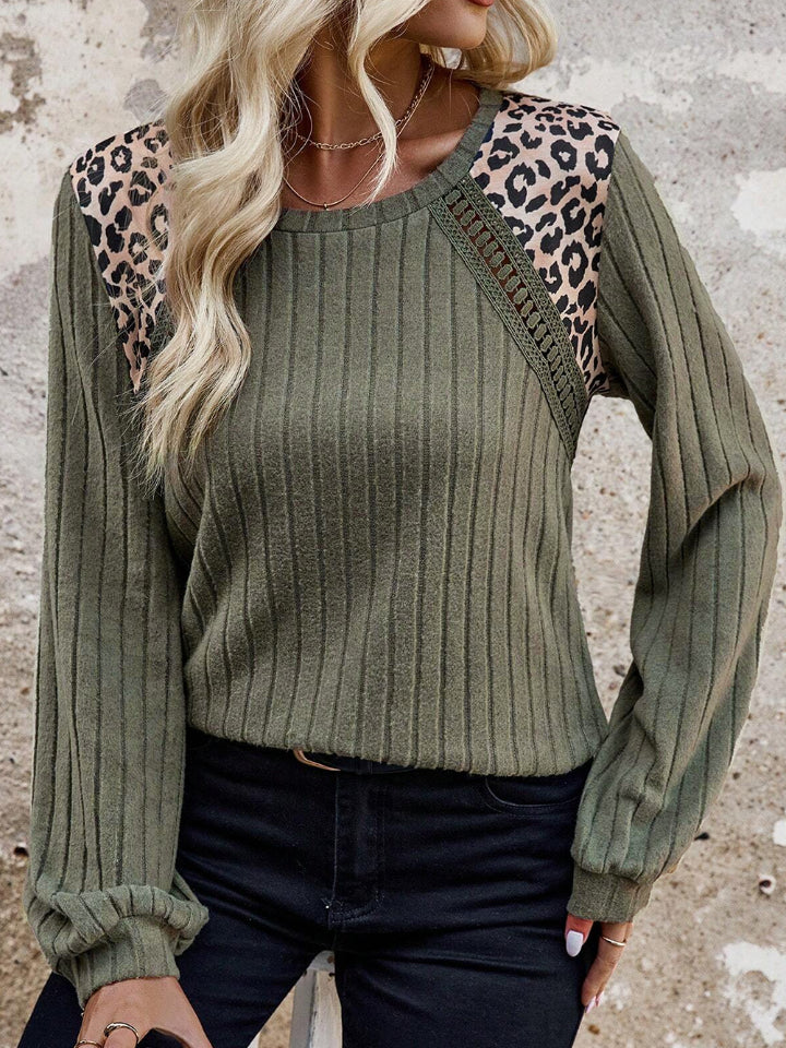 Army green ribbed knit top with leopard print shoulder detail and cutout accents.