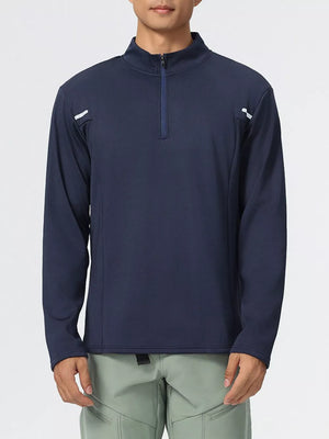 Men's dark navy half-zip sweatshirt with reflective shoulder details.