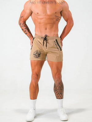 Khaki athletic shorts with drawstring and zippered pockets, featuring logo details.