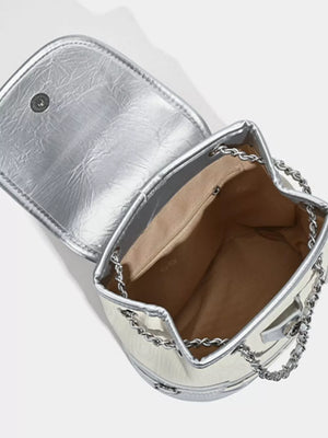 Charming mini heart flap backpack in white with silver trim and chain straps.