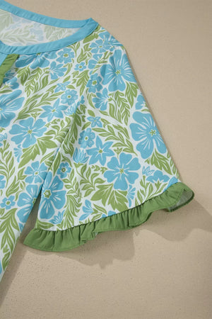 Floral ruffled half sleeve maternity blouse with blue flowers and green leaves