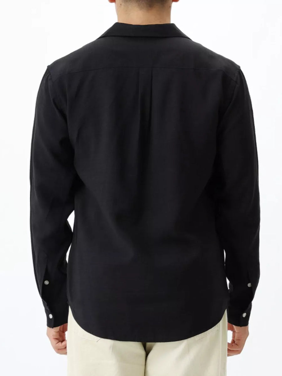 Black relaxed camp collar button-up shirt with buttoned cuffs.