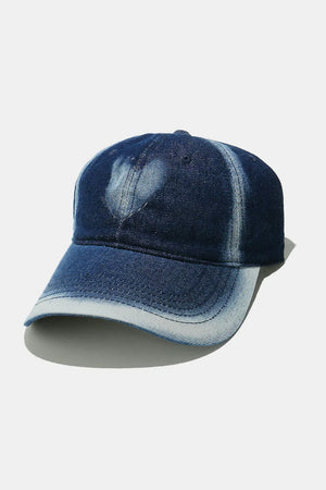 Bleached heart denim baseball cap in a faded blue wash.