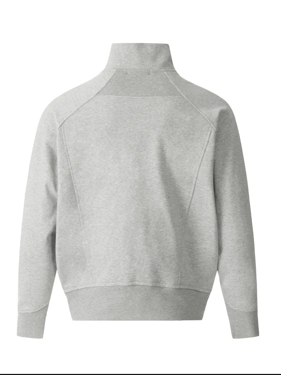 Gray zip-up sweatshirt with sculpted seam details and mock neck.