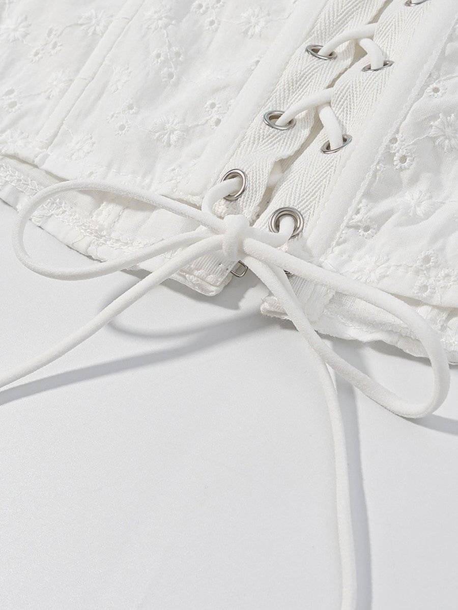 White eyelet tank top with corset lace-up detail and ruffle trim