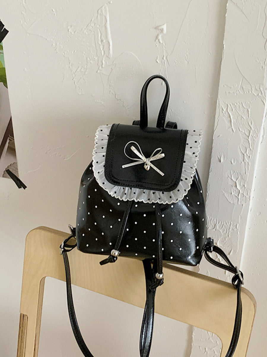 backpack in black with polka-dot and lace trim