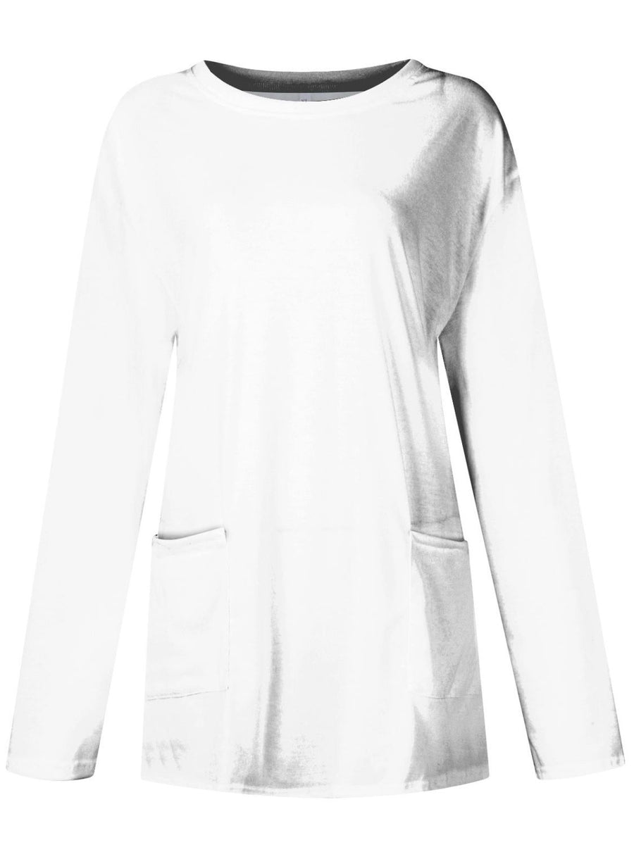 White relaxed fit tunic with long sleeves and two patch pockets.