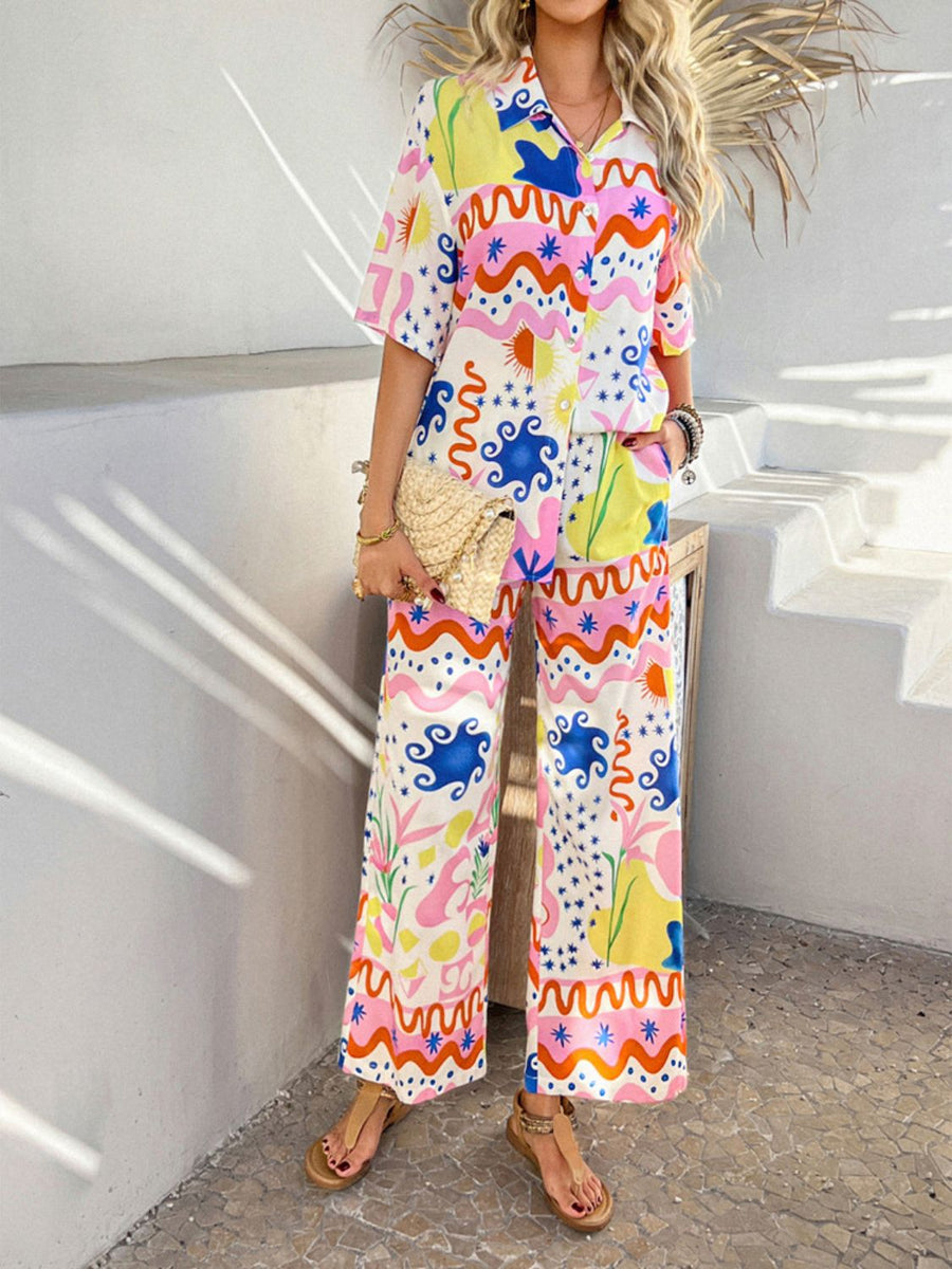 Women's abstract print wide leg pants in multicolor with button front and collared shirt.