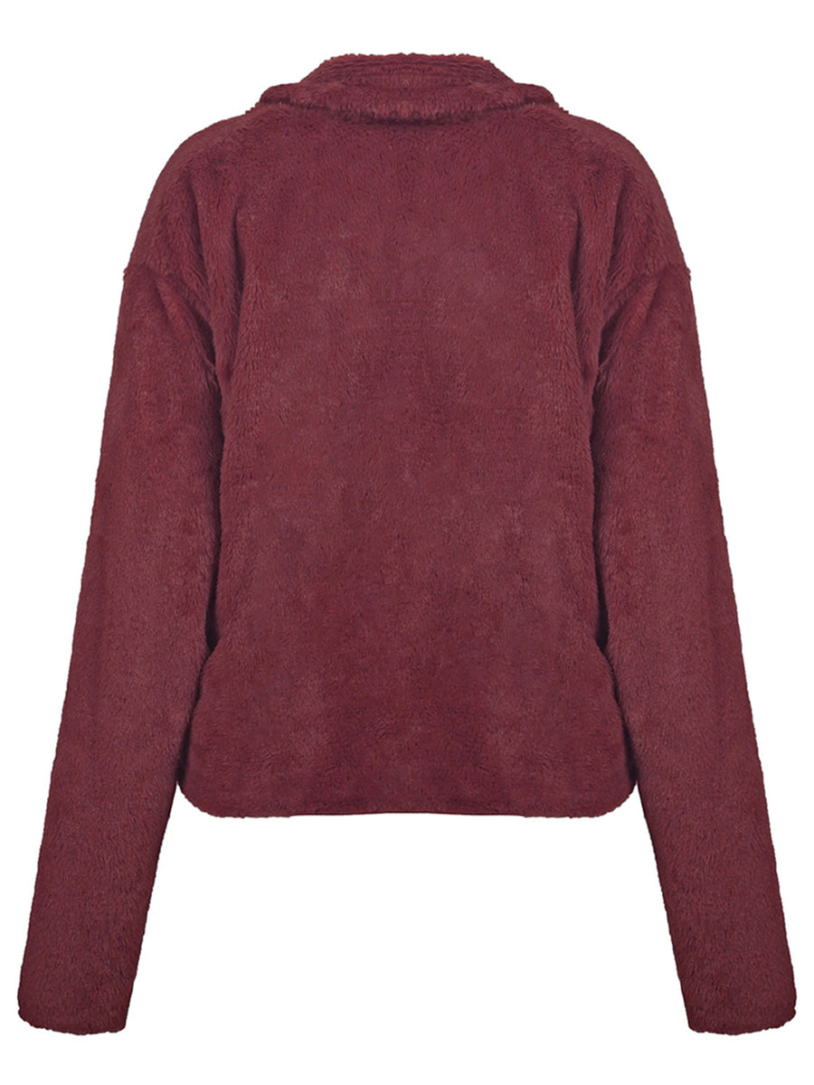Burgundy faux fur biker jacket with a collared neckline and long sleeves.