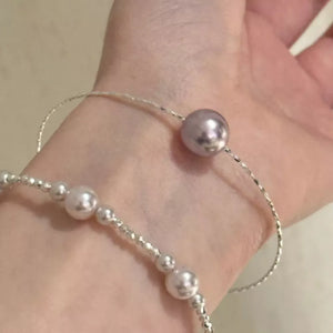 Synthetic Pearl,925 sterling silver Care instructions: Avoid wearing during exer bracelet in cream with fitted silhouette