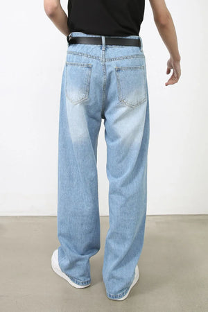 Light blue faded denim baggy jeans with a relaxed fit.