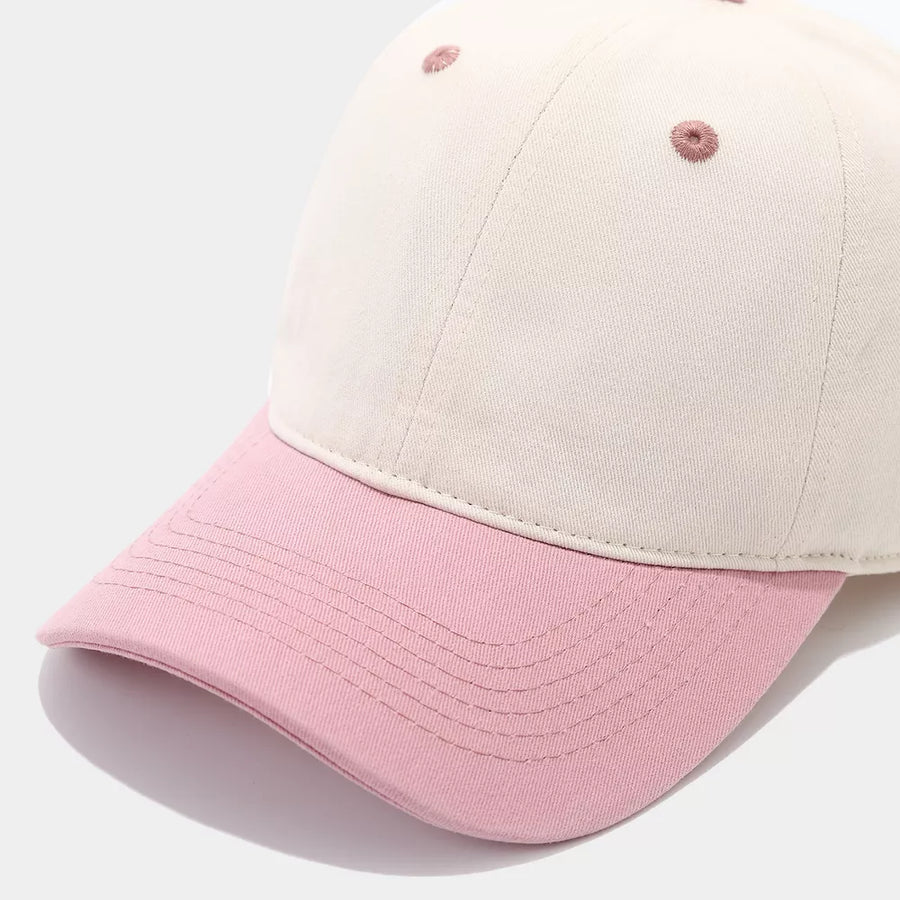 blush pink cap featuring curved brim and color-block