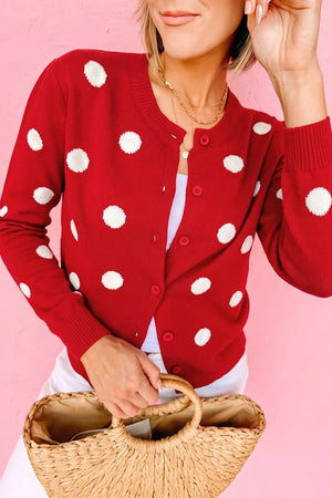 white cardigan featuring buttoned and polka dot