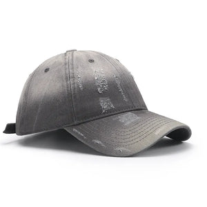 Gray distressed cotton baseball cap with frayed details.