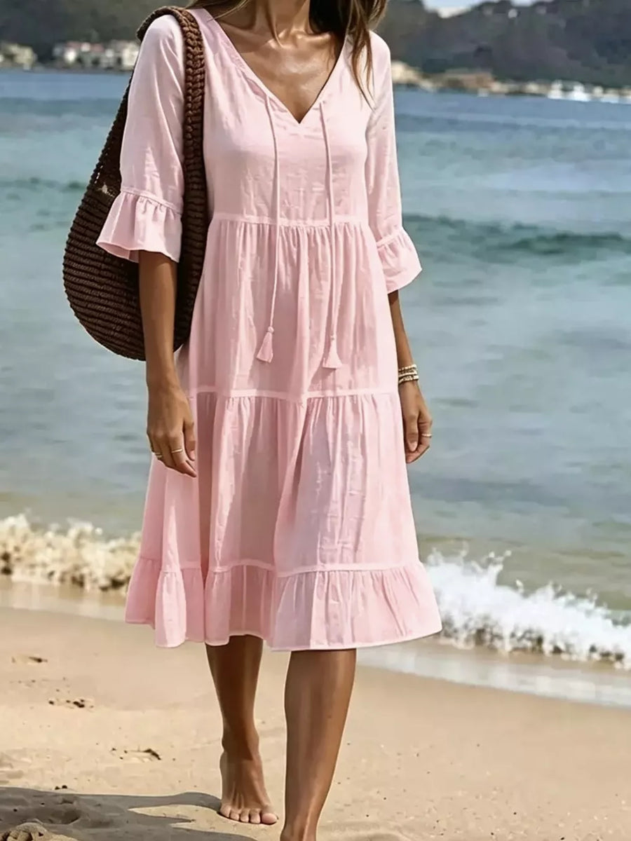 white midi dress with flounce sleeve and flounce sleeve