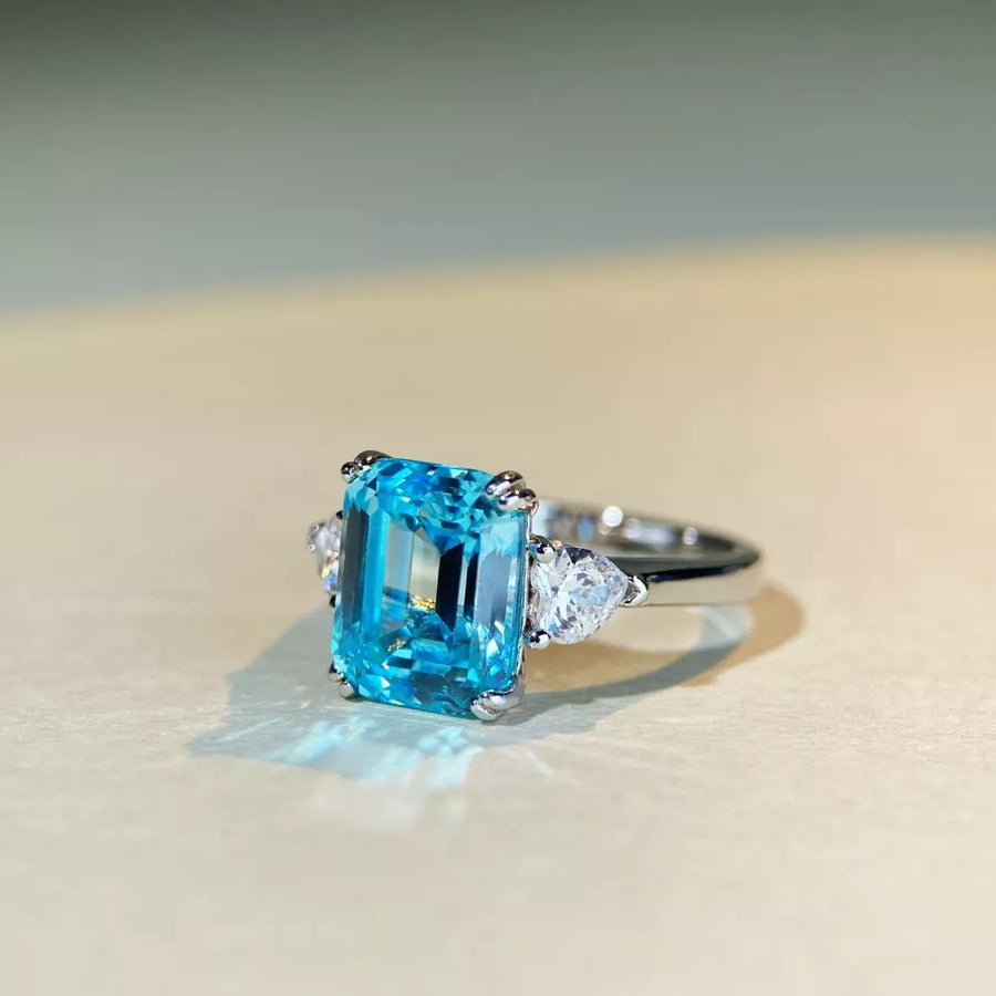 ring in silver with geometric and emerald cut stone