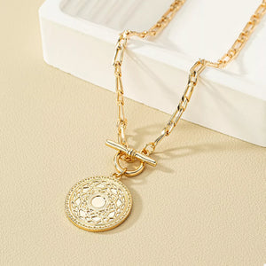 Silver necklace featuring chain link and geometric