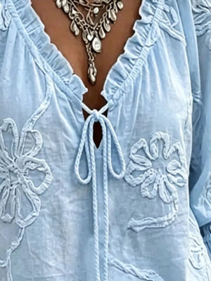 White blouse featuring embroidered and floral