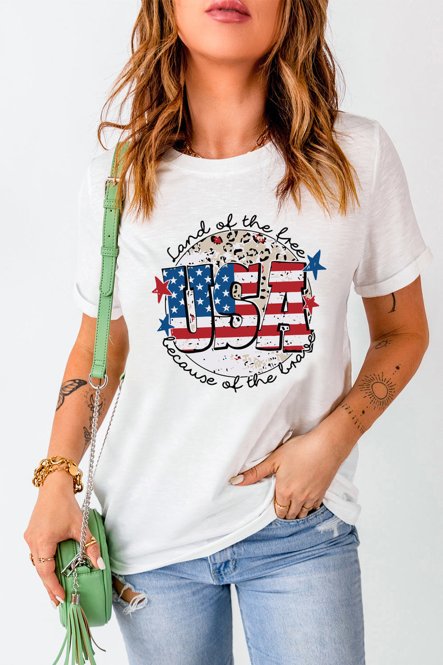White graphic tee with USA flag design and leopard print detail.