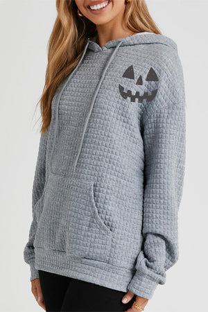 Charcoal waffle knit hoodie with jack-o-lantern graphic and front pocket.