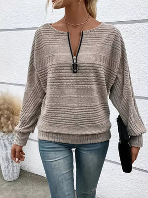 Khaki ribbed quarter zip sweatshirt with O-ring pull and dolman sleeves.