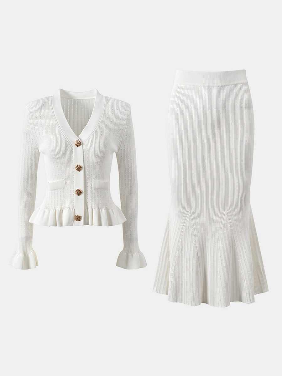 White knit cardigan with ruffled hem and bell sleeves, paired with a matching mermaid skirt.