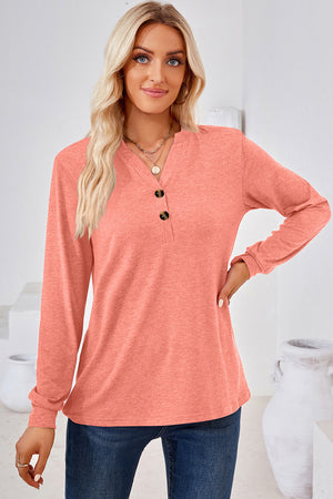 Henley button-down knit top in watermelon pink with a V-neck and two buttons.