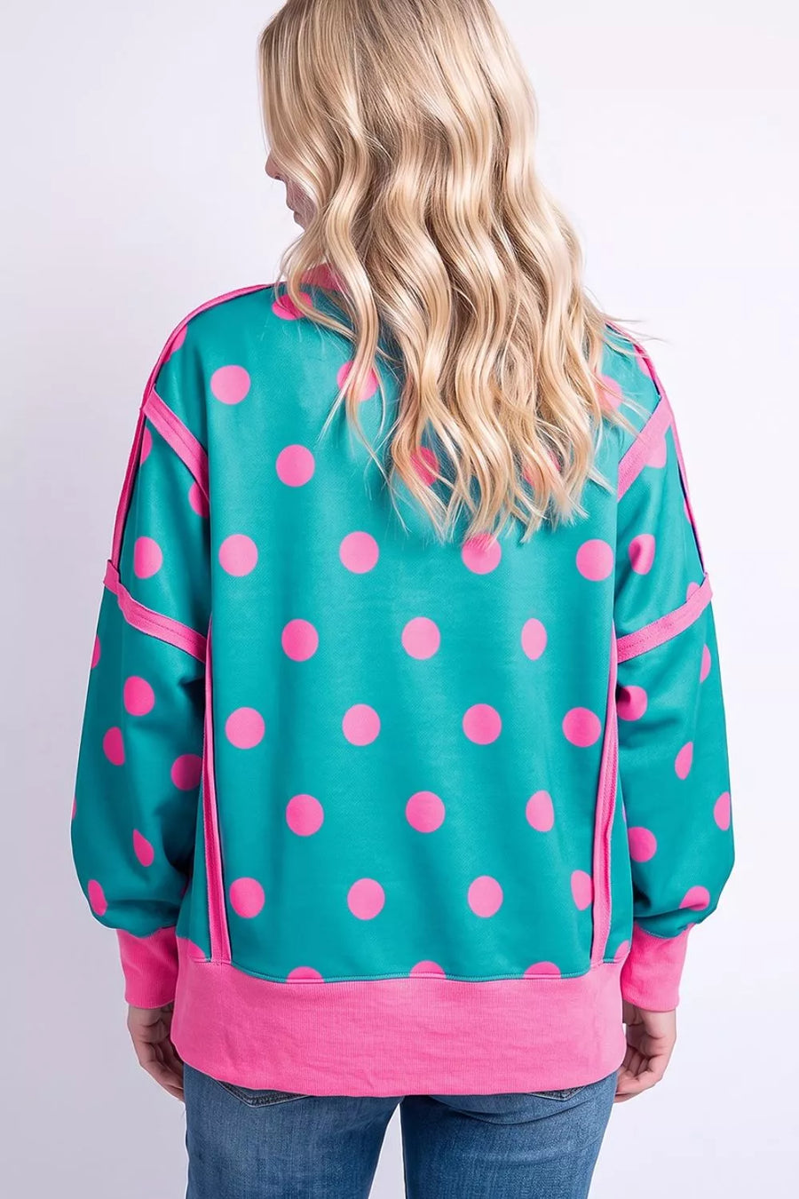 hot pink sweatshirt featuring exposed seam and polka-dot