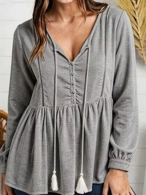 peplum top in slate gray featuring waffle-knit and peplum fit