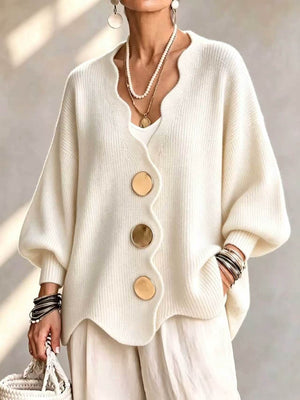 cardigan in cream featuring scalloped edge and oversized fit