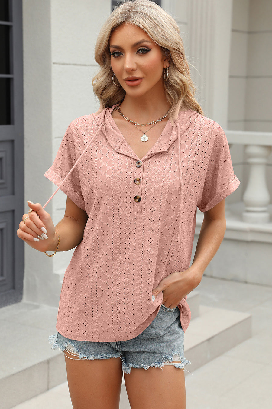 Blush pink perforated henley hooded tee with short sleeves and button detail