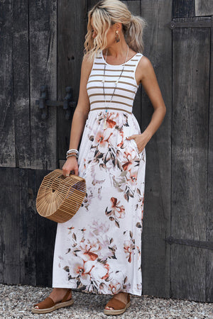 Striped bodice floral maxi dress with pockets and a round neckline.