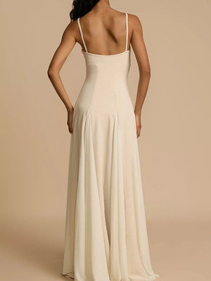 Cream sweetheart neck maxi dress with spaghetti straps and flowing skirt.