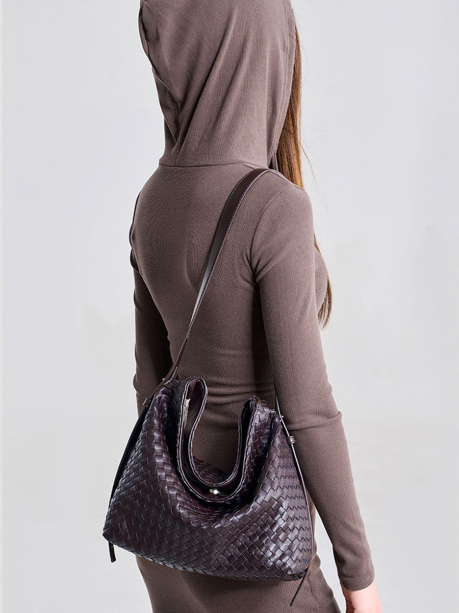 handbag in dark brown with woven and woven texture