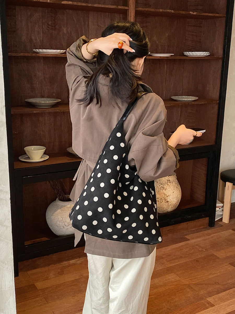 handbag in black with polka-dot and pocketed