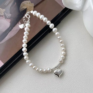 Freshwater Pearl,925 sterling silver Care instructions: Avoid wearing during exe bracelet in silver with not applicable
