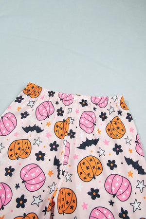 light pink pajama set with half-button and novelty print